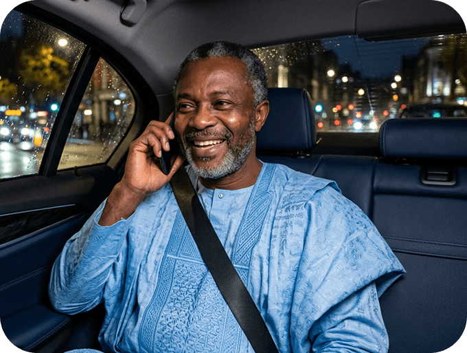Odogwu partner speaking on a phone in a car